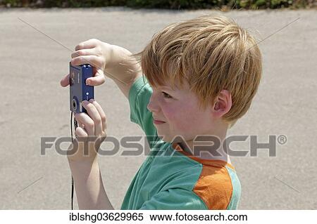 "Young boy taking pictures, Vrbnik, Krk, Kvarner Gulf, Croatia, Europe" View Large Photo Image Stock Photography - "Young boy taking pictures, Vrbnik, Krk, Kvarner Gulf, Croatia, Europe". Fotosearch