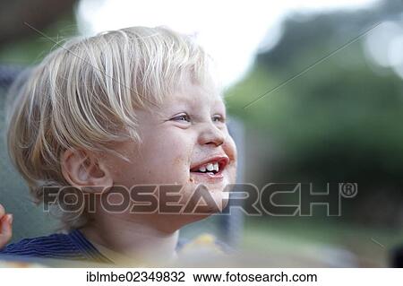 Young boy with his mouth smeared with chocolate View Large Photo Image Stock Image - Young boy with his mouth smeared with chocolate. Fotosearch