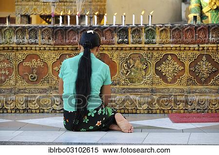 "Young Buddhist woman praying at Shwedagon Pagoda, Yangon, Yangon Region, Myanmar, Burma, Asia" View Large Photo Image Stock Photography - "Young Buddhist woman praying at Shwedagon Pagoda, Yangon, Yangon Region, Myanmar, Burma, Asia". Fotosearch