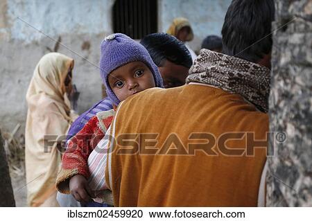 "Young child on the arm of his father, villagers near Rajbiraj, Terai region, Nepal, Asia" View Large Photo Image Stock Image - "Young child on the arm of his father, villagers near Rajbiraj, Terai region, Nepal, Asia". Fotosearch
