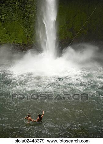 "Young couple, 25 and 28, bathing at the Fortuna Waterfall, La Catarata de la Fortuna, La Fortuna, Costa Rica, Central America, North America" View Large Photo Image Stock Photo - "Young couple, 25 and 28, bathing at the Fortuna Waterfall, La Catarata de la Fortuna, La Fortuna, Costa Rica, Central America, North America". Fotosearch