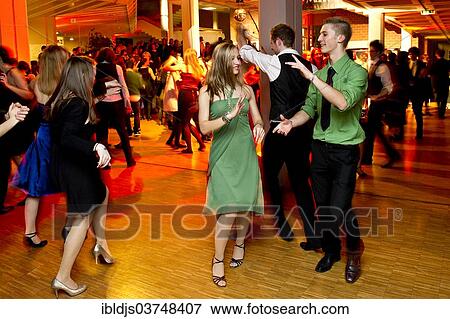 "Young couple dancing at the prom of a dance school, Germany, Europe" View Large Photo Image Stock Photo - "Young couple dancing at the prom of a dance school, Germany, Europe". Fotosearch