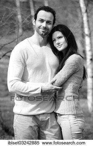 Stock Photography - "Young couple embracing, in a birch forest, Austria, Europe". Fotosearch