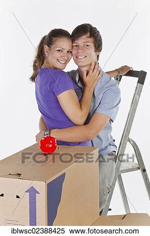 "Young couple, house moving" View Large Photo Image Stock Photography - "Young couple, house moving". Fotosearch