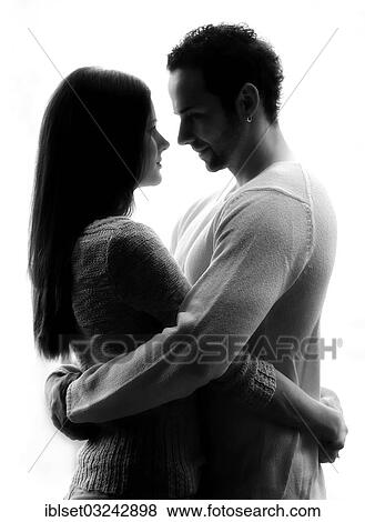 "Young couple looking into each other's eyes, backlit, Austria, Europe" View Large Photo Image Stock Photo - "Young couple looking into each other's eyes, backlit, Austria, Europe". Fotosearch