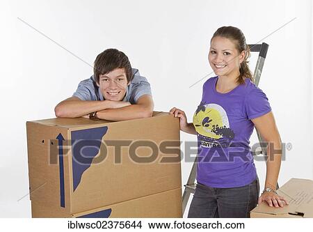 Young couple on moving day View Large Photo Image Picture - Young couple on moving day. Fotosearch