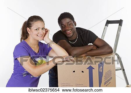Young couple on moving day View Large Photo Image Picture - Young couple on moving day. Fotosearch