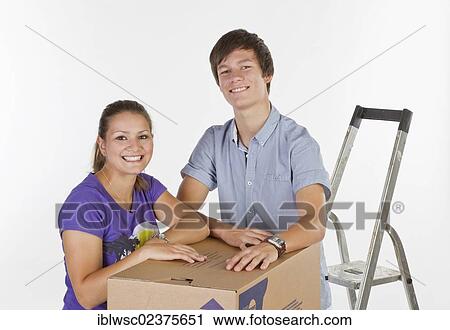 Young couple on moving day View Large Photo Image Stock Image - Young couple on moving day. Fotosearch