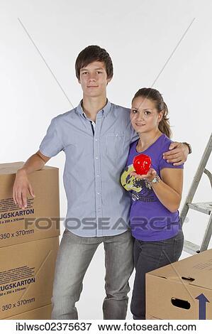 Young couple on moving day View Large Photo Image Stock Photo - Young couple on moving day. Fotosearch
