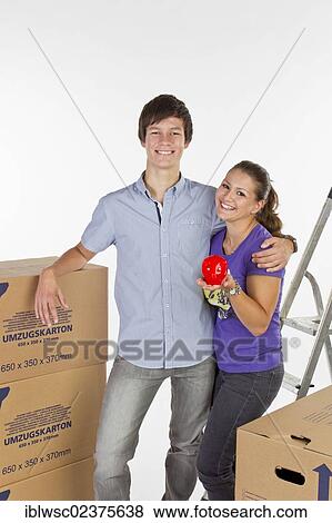 Young couple on moving day View Large Photo Image Stock Photo - Young couple on moving day. Fotosearch