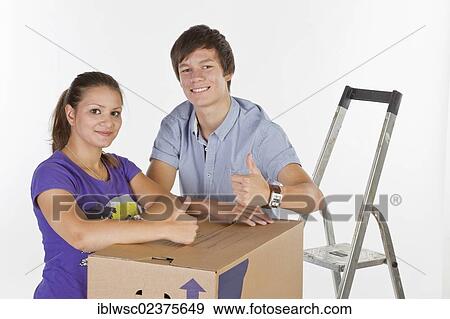 Young couple on moving day View Large Photo Image Stock Photo - Young couple on moving day. Fotosearch
