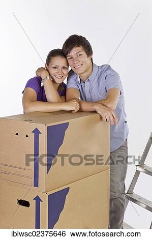 Young couple on moving day View Large Photo Image Stock Photograph - Young couple on moving day. Fotosearch