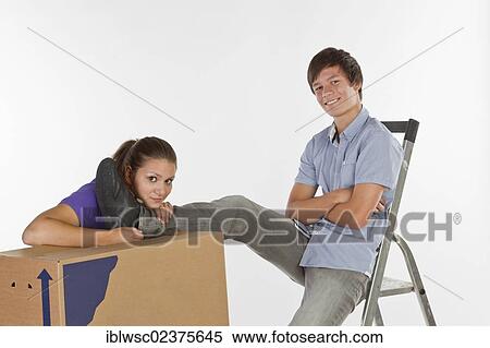 Young couple on moving day View Large Photo Image Stock Photography - Young couple on moving day. Fotosearch