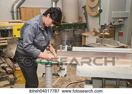 "Young farmer repairing a hay rake, sharpening teeth on the belt sander, Sprenger family farm, Schwaz District, Tyrol, Austria Family" View Large Photo Image Stock Photo - "Young farmer repairing a hay rake, sharpening teeth on the belt sander, Sprenger family farm, Schwaz District, Tyrol, Austria Family". Fotosearch