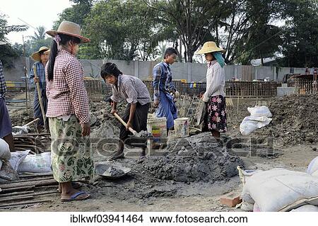 "Young female and male construction workers on a high rise construction site, Mandalay, Myanmar, Asia" View Large Photo Image Picture - "Young female and male construction workers on a high rise construction site, Mandalay, Myanmar, Asia". Fotosearch