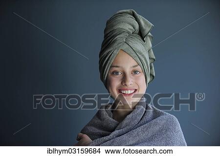 Picture - "Young girl, 10, after a bath wearing a towel turban". Fotosearch