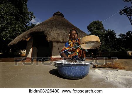 "Young girl sifting flour in the village of Idool, Idool, Adamawa Region, Cameroon, Africa" View Large Photo Image Stock Image - "Young girl sifting flour in the village of Idool, Idool, Adamawa Region, Cameroon, Africa". Fotosearch