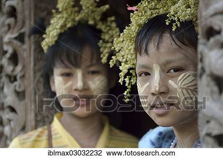 "Young girls with thanaka and flower decoration, portrait, Shwe Inbin Monastery, Mandalay, Mandalay, Myanmar, Burma, Asia" View Large Photo Image Stock Image - "Young girls with thanaka and flower decoration, portrait, Shwe Inbin Monastery, Mandalay, Mandalay, Myanmar, Burma, Asia". Fotosearch
