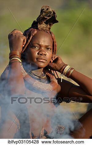 "Young Himba woman at a campfire, Ombombo, Kaokoland, Kunene, Namibia, Africa" View Large Photo Image Stock Photo - "Young Himba woman at a campfire, Ombombo, Kaokoland, Kunene, Namibia, Africa". Fotosearch