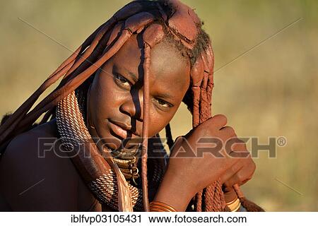 "Young Himba woman doing her hair, Ombombo, Kaokoland, Kunene, Namibia, Africa" View Large Photo Image Stock Image - "Young Himba woman doing her hair, Ombombo, Kaokoland, Kunene, Namibia, Africa". Fotosearch