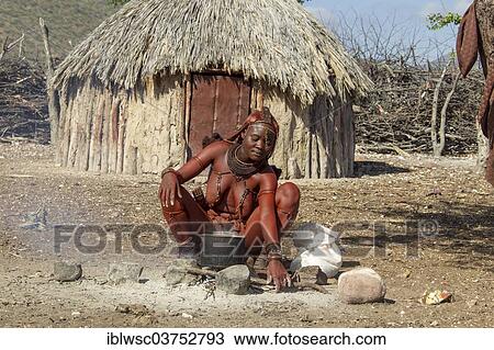 "Young Himba woman, sitting at a cooking pit in front of a hut, Kaokoland, Kunene, Namibia, Africa" View Large Photo Image Stock Image - "Young Himba woman, sitting at a cooking pit in front of a hut, Kaokoland, Kunene, Namibia, Africa". Fotosearch