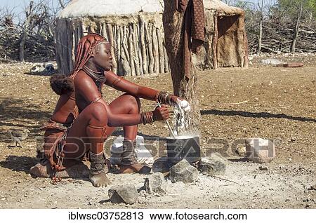 "Young Himba woman, sitting at a cooking pit in front of a hut, Kaokoland, Kunene, Namibia, Africa" View Large Photo Image Stock Image - "Young Himba woman, sitting at a cooking pit in front of a hut, Kaokoland, Kunene, Namibia, Africa". Fotosearch