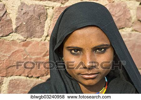 "Young Indian woman wearing a black head scarf and a nose ring, portrait, Fatehpur Sikri, Uttar Pradesh, India, Asia" View Large Photo Image Stock Photo - "Young Indian woman wearing a black head scarf and a nose ring, portrait, Fatehpur Sikri, Uttar Pradesh, India, Asia". Fotosearch
