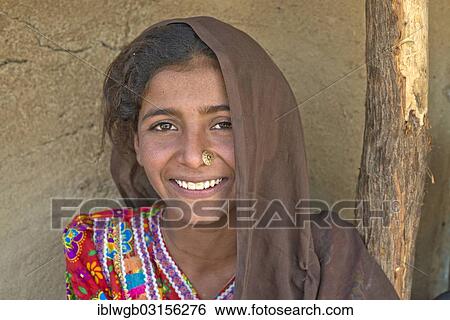 "Young Indian woman with a headscarf and nose jewellery, Gujarat, India, Asia" View Large Photo Image Stock Photograph - "Young Indian woman with a headscarf and nose jewellery, Gujarat, India, Asia". Fotosearch