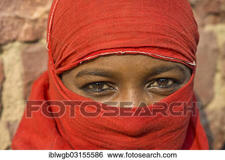 Stock Photograph - "Young indian woman with a red veil, portrait, Fatehpur Sikri, Uttar Pradesh, India, Asia". Fotosearch