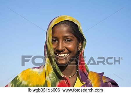 Stock Photograph - "Young Indian woman with colourful scarf, portrait, Pushkar, Rajasthan, India, Asia". Fotosearch