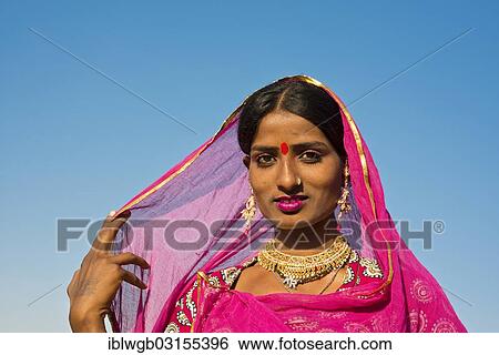 "Young Indian woman with pink scarf and jewellery, portrait, Pushkar, Rajasthan, India, Asia" View Large Photo Image Stock Photograph - "Young Indian woman with pink scarf and jewellery, portrait, Pushkar, Rajasthan, India, Asia". Fotosearch