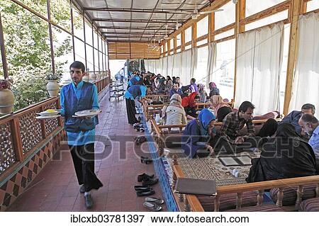 "Young Iranians having lunch in a traditional restaurant, Bazaar, Isfahan, Isfahan Province, Persia, Iran, Asia" View Large Photo Image Stock Photo - "Young Iranians having lunch in a traditional restaurant, Bazaar, Isfahan, Isfahan Province, Persia, Iran, Asia". Fotosearch
