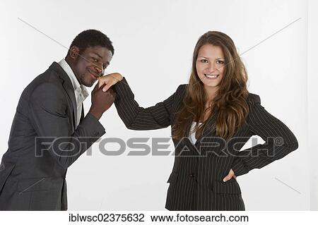 Young man giving a young woman a kiss on the hand View Large Photo Image Stock Image - Young man giving a young woman a kiss on the hand. Fotosearch