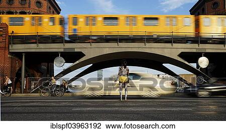 "Young man painted in Polynesian patterns standing on a street as a car and a subway pass, Berlin, Germany, Europe" View Large Photo Image Stock Image - "Young man painted in Polynesian patterns standing on a street as a car and a subway pass, Berlin, Germany, Europe". Fotosearch