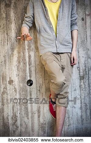 Young man playing with a yo-yo View Large Photo Image Stock Photography - Young man playing with a yo-yo. Fotosearch