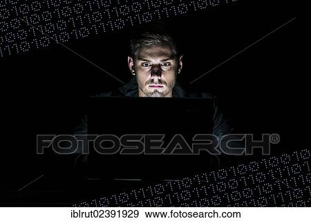 "Young man sitting at a computer, surrounded by binary numbers, 0s and 1s" View Large Photo Image Stock Photo - "Young man sitting at a computer, surrounded by binary numbers, 0s and 1s". Fotosearch