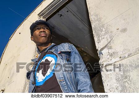"Young man standing at his front door, Township, Plettenberg Bay, Garden Route, Eden District, Western Cape, South Africa, Africa" View Large Photo Image Stock Image - "Young man standing at his front door, Township, Plettenberg Bay, Garden Route, Eden District, Western Cape, South Africa, Africa". Fotosearch