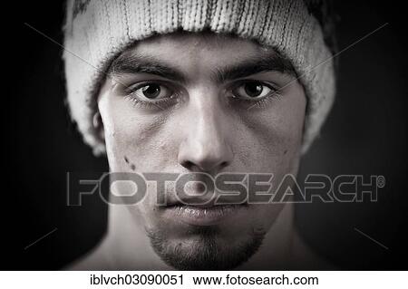 "Young man wearing a knitted woollen beanie, portrait, Innsbruck, Tyrol, Austria, Europe" View Large Photo Image Stock Image - "Young man wearing a knitted woollen beanie, portrait, Innsbruck, Tyrol, Austria, Europe". Fotosearch