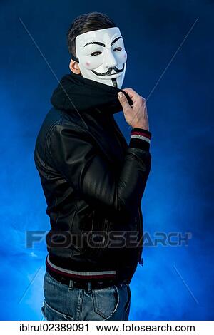 Young man wearing an anonymous mask and a black leather jacket View Large Photo Image Stock Image - Young man wearing an anonymous mask and a black leather jacket. Fotosearch