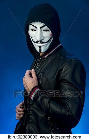 Young man wearing an anonymous mask with a hood and a black leather jacket View Large Photo Image Stock Image - Young man wearing an anonymous mask with a hood and a black leather jacket. Fotosearch