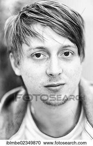 Stock Image - "Young man with a fashionable hairstyle, portrait". Fotosearch