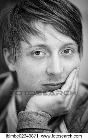 "Young man with a fashionable hairstyle, portrait" View Large Photo Image Stock Image - "Young man with a fashionable hairstyle, portrait". Fotosearch
