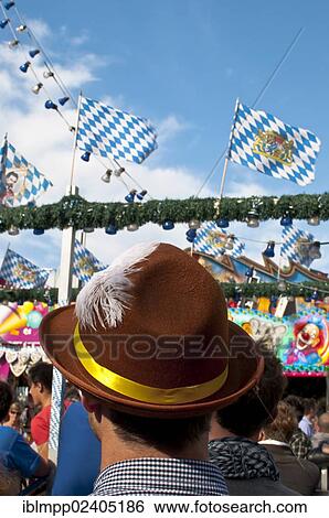 Stock Photograph - "Young man with Oktoberfest hat, Oktoberfest, Munich, Bavaria, Germany, Europe". Fotosearch