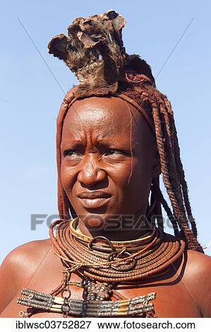 Stock Photo - "Young married Himba woman, in traditional costume and headdress, Kaokoland, Kunene, Namibia, Africa". Fotosearch