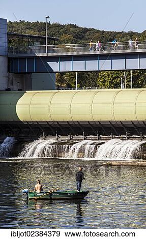 "Young men in a rowing boat with an outboard engine fishing on the Ruhr river, in front of the dam of lake Baldeneysee, Essen, North Rhine-Westphalia, Germany, Europe" View Large Photo Image Stock Photo - "Young men in a rowing boat with an outboard engine fishing on the Ruhr river, in front of the dam of lake Baldeneysee, Essen, North Rhine-Westphalia, Germany, Europe". Fotosearch