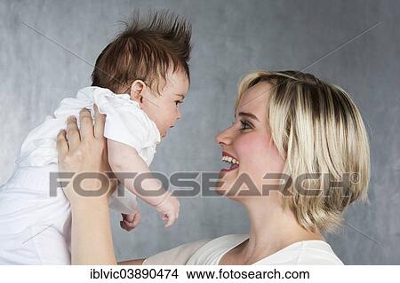 "Young mother with baby, 5 months, Germany, Europe" View Large Photo Image Picture - "Young mother with baby, 5 months, Germany, Europe". Fotosearch