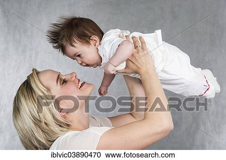 "Young mother with baby, 5 months, Germany, Europe" View Large Photo Image Stock Image - "Young mother with baby, 5 months, Germany, Europe". Fotosearch