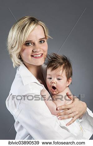 "Young mother with baby, 5 months, Germany, Europe" View Large Photo Image Stock Photo - "Young mother with baby, 5 months, Germany, Europe". Fotosearch