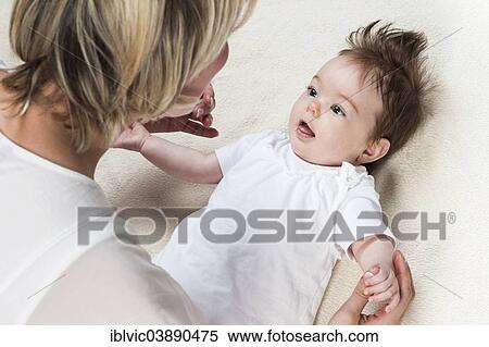 "Young mother with baby, 5 months, Germany, Europe" View Large Photo Image Stock Photography - "Young mother with baby, 5 months, Germany, Europe". Fotosearch