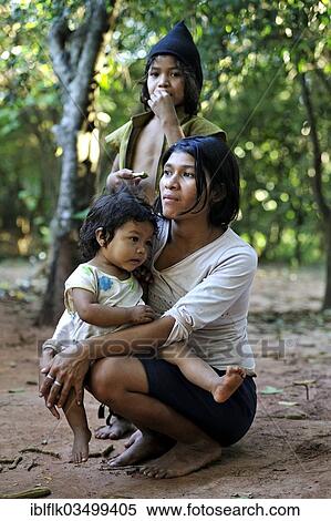 "Young mother with two girls in the community of Mbya-Guarani Indians, Campito, Caaguazu Department, Paraguay, South America" View Large Photo Image Stock Photography - "Young mother with two girls in the community of Mbya-Guarani Indians, Campito, Caaguazu Department, Paraguay, South America". Fotosearch
